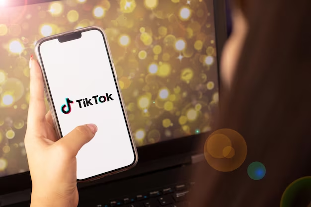 Woman holding phone with open tik tok
